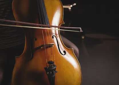 mid-section-female-student-playing-double-bass