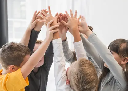 children-with-their-hands-up